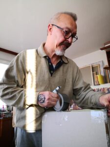 Igor Shulman is packaging painting to deliver a customer
