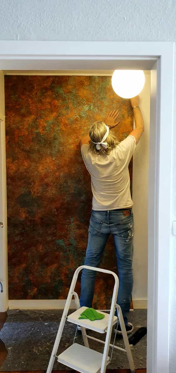 Oil painting ‘Bless And Save’ by Igor Shulman hanging on the wall in Joerg Sievers’ living room, beautifully framed and adding warmth to the space.
