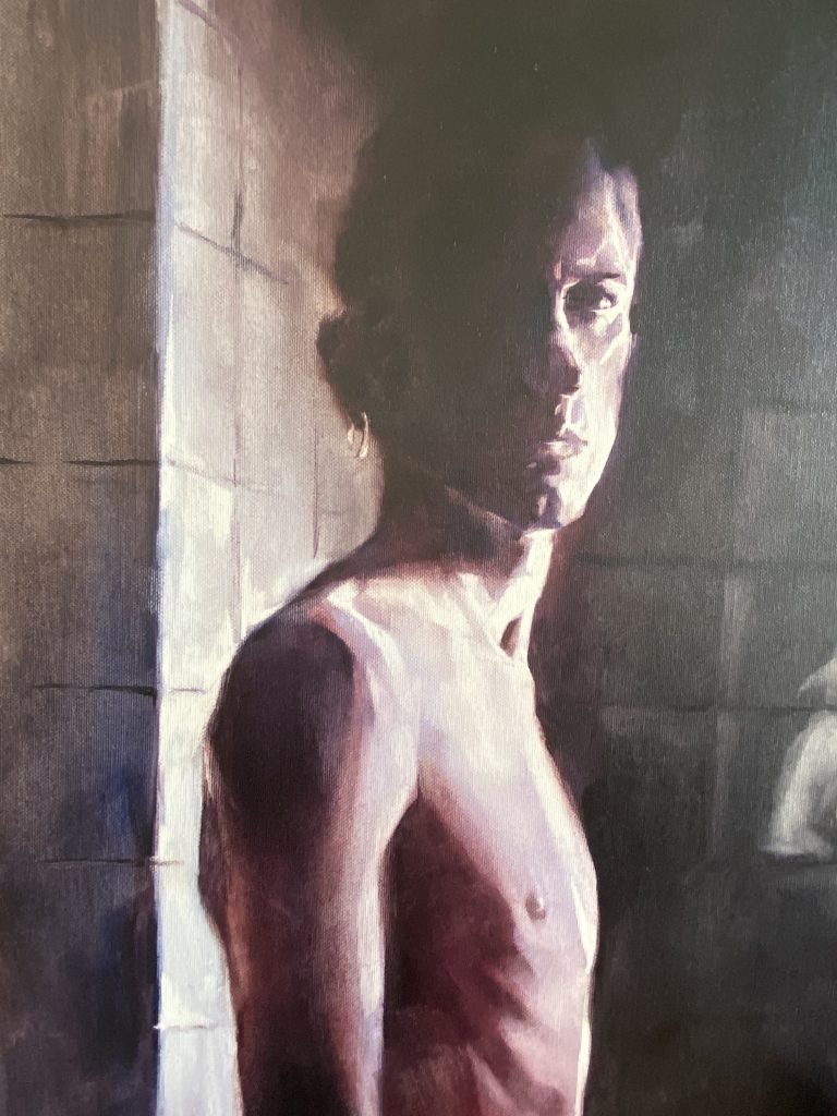 Close-up of reddish-purple oil paint layering across the figure's upper back and shoulder