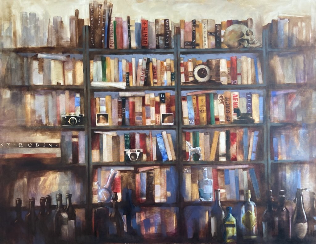 A close-up of a bookshelf filled with old and new books, photo frames, trinkets, and collectibles.