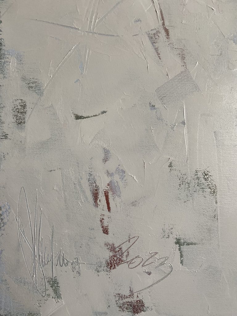 Background surface showing layered white and grey paint