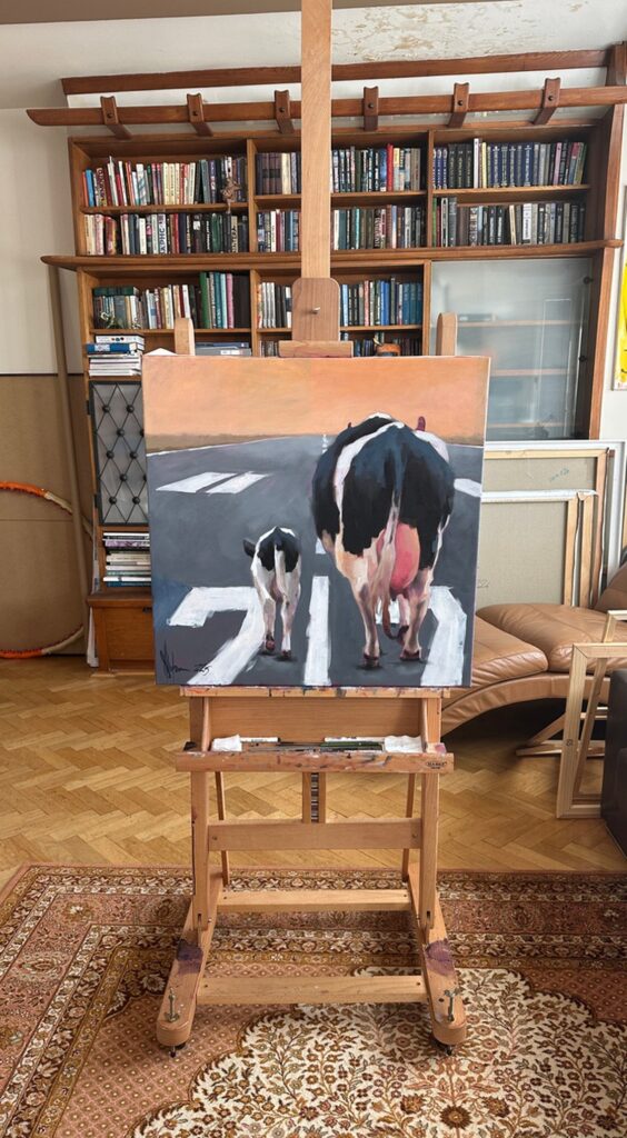 Igor Shulman’s oil painting Take Off displayed on an easel in the artist’s studio.