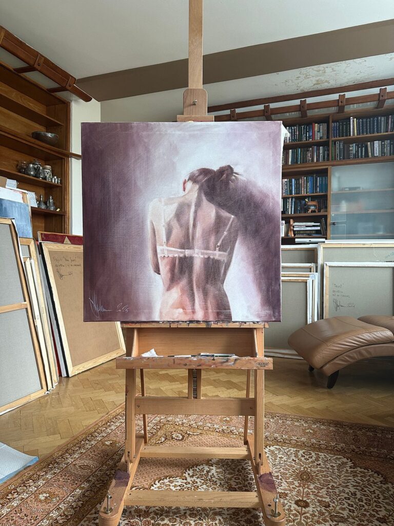 Igor Shulman’s oil painting Evening Etude displayed on an easel in his studio.
