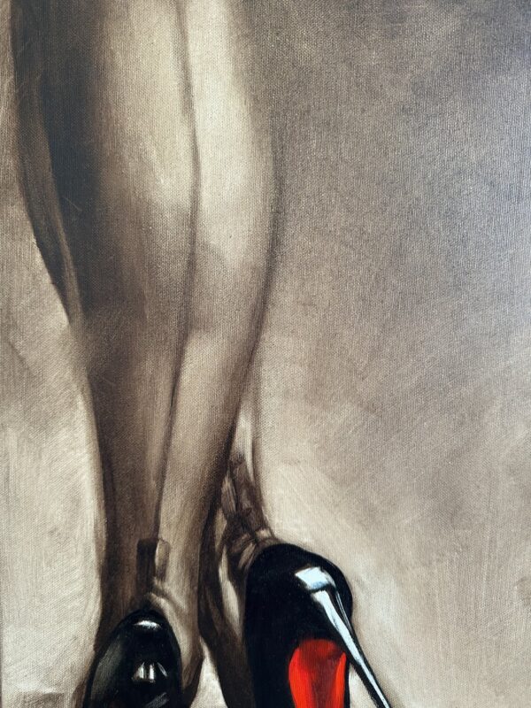 Close-up of fluid brushstrokes highlighting red shoes in oil painting.