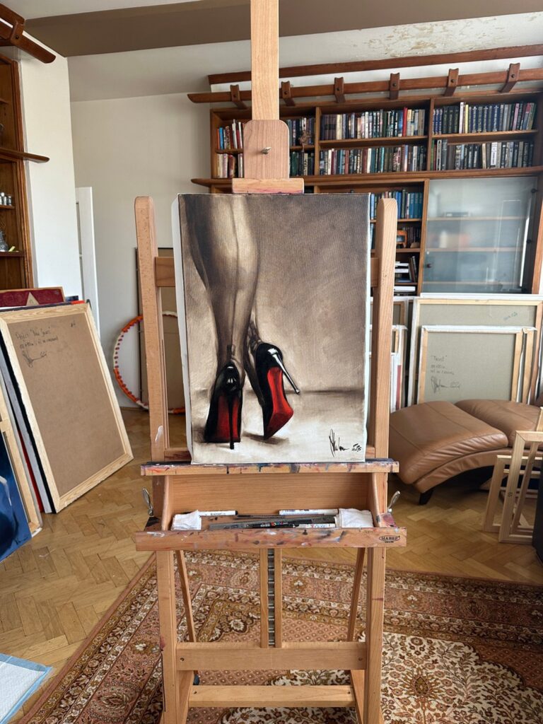 Igor Shulman’s oil painting Louboutin Etude 2 displayed on an easel in the artist’s studio.