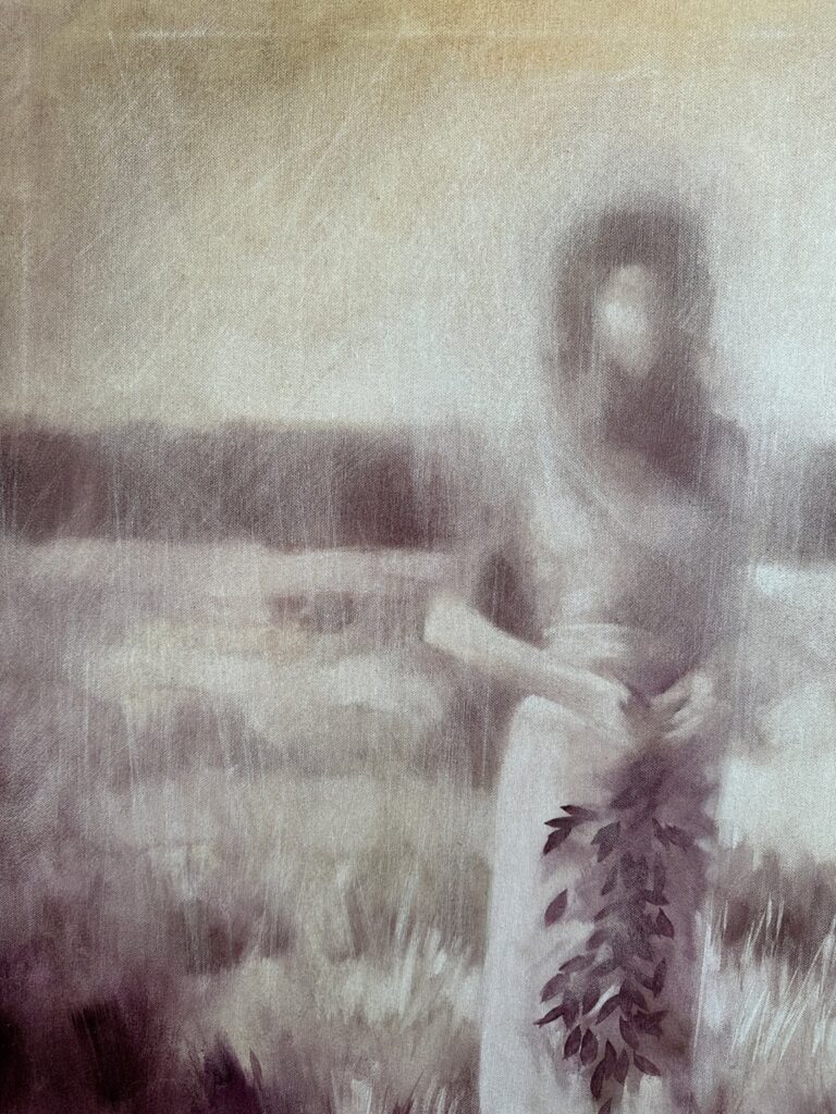 Close-up of layered oil paint textures in expressive portrait.