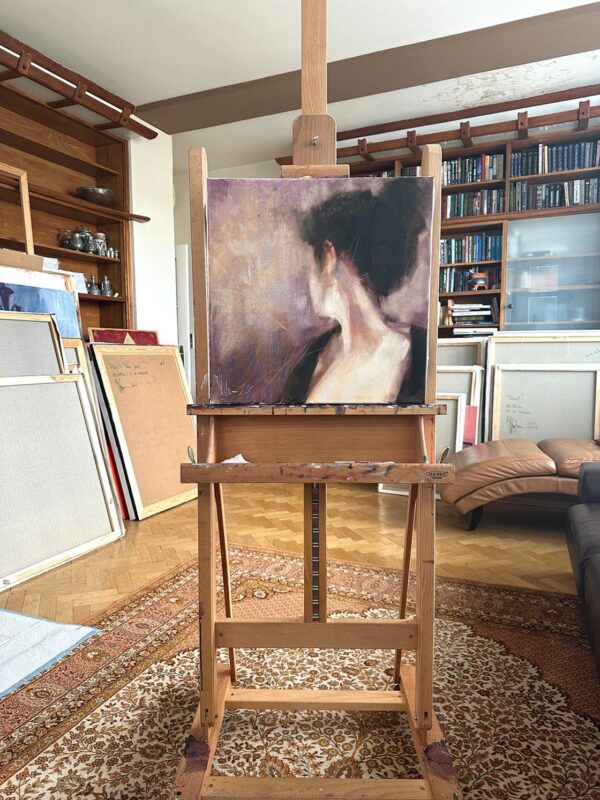 Igor Shulman’s Emotional Portrait displayed on an easel in the artist’s studio.