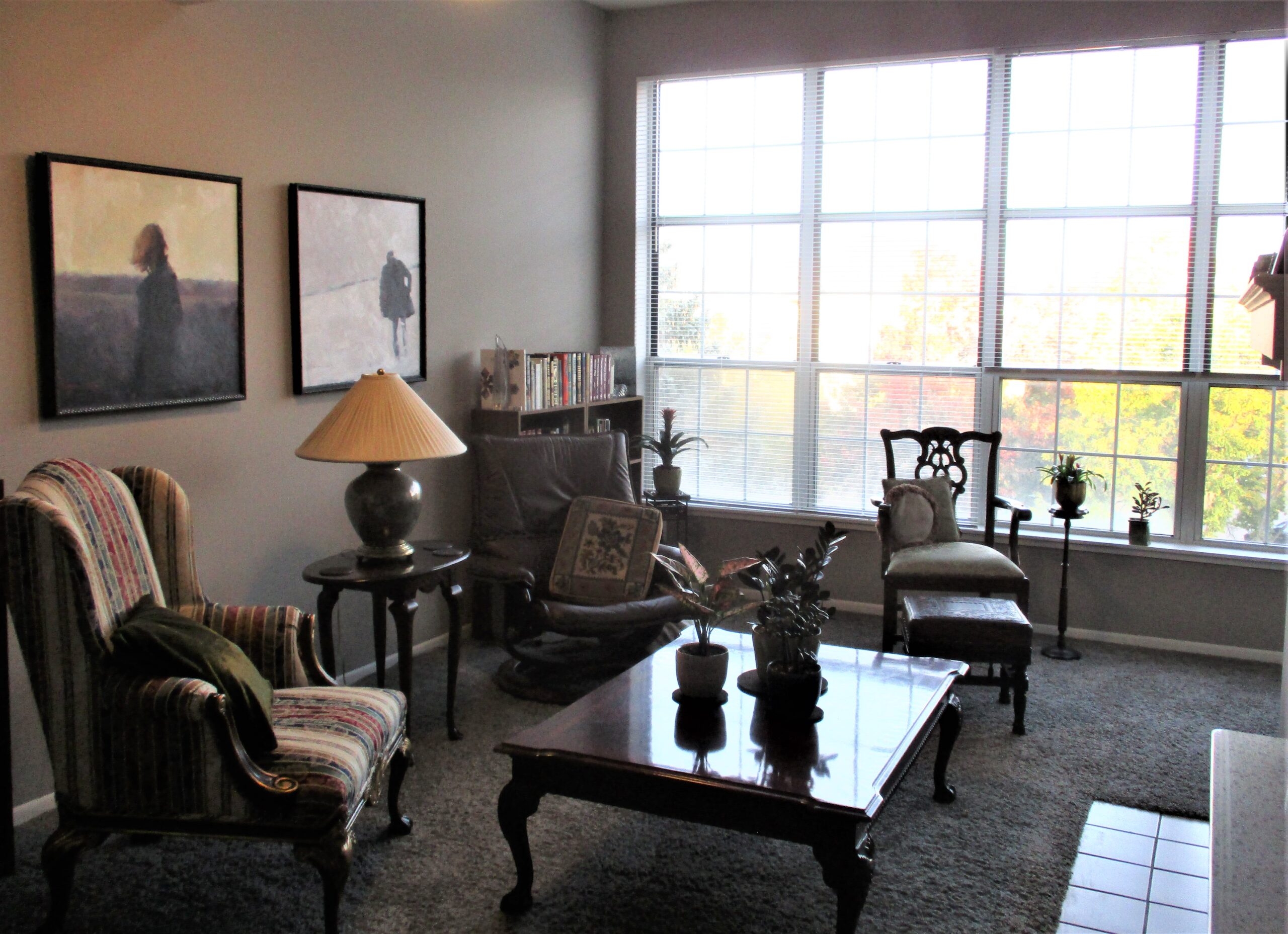 View of Connie’s living room with Igor Shulman’s paintings A Sunken Horizon and It’s a Strange Place