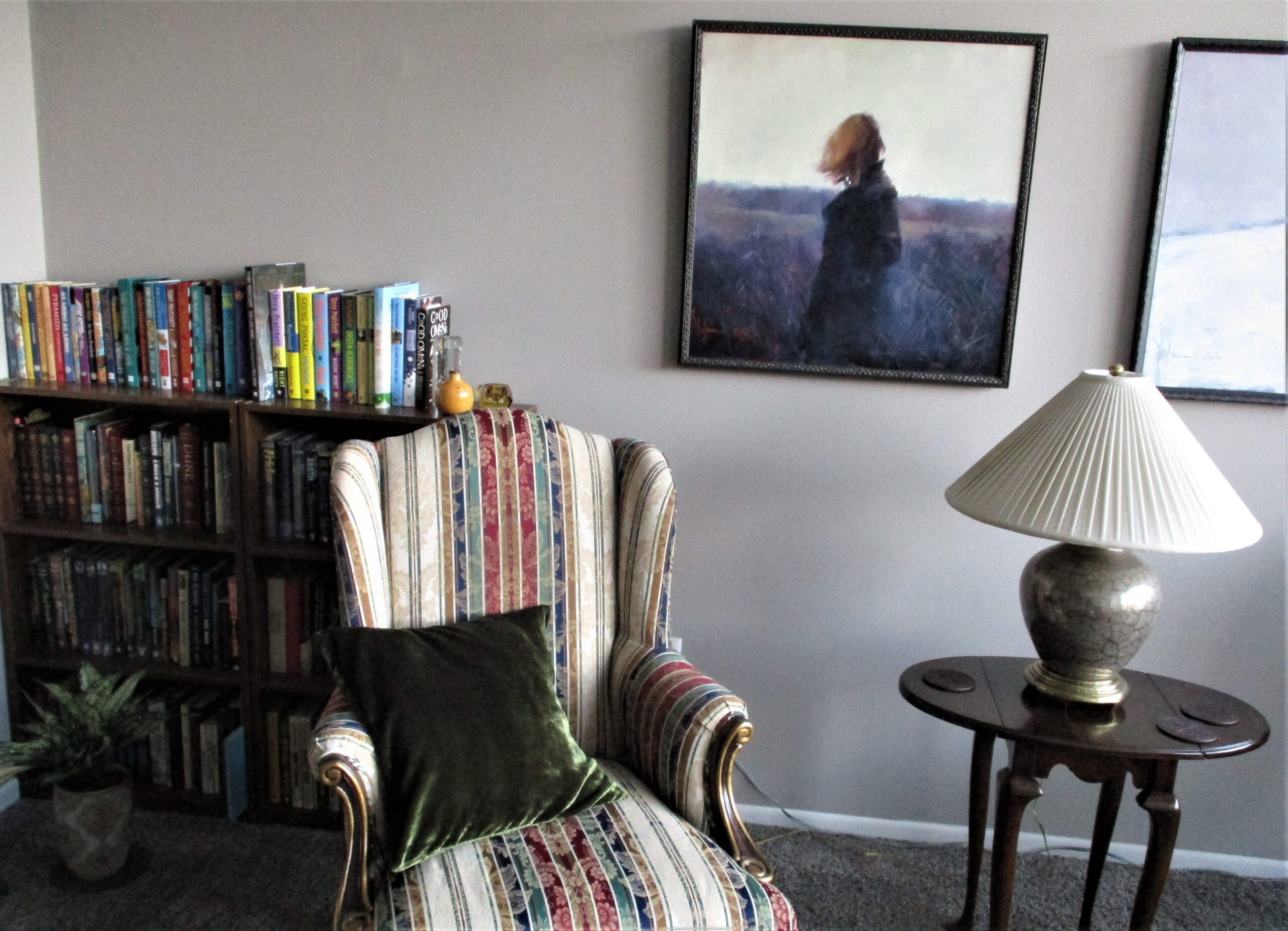 Painting It’s a Strange Place by Igor Shulman hanging in Connie’s home interior