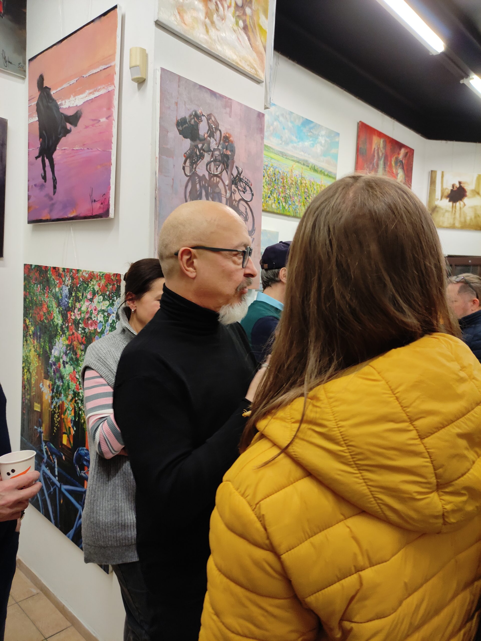 Igor Shulman among visitors with his paintings displayed at ART Gallery 11 Prague