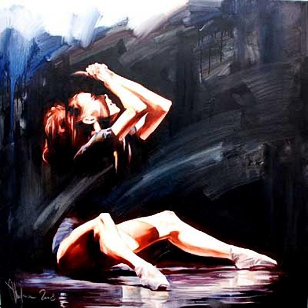 Female ballet dancer in dark leotard and pointe shoes, arching back with hands clasped overhead, set against a dark, textured background.