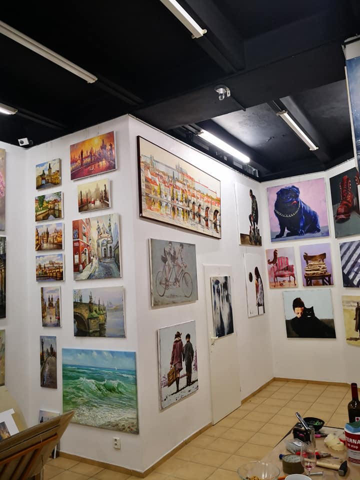 Wall display of Igor Shulman paintings at ART Gallery 11 Prague