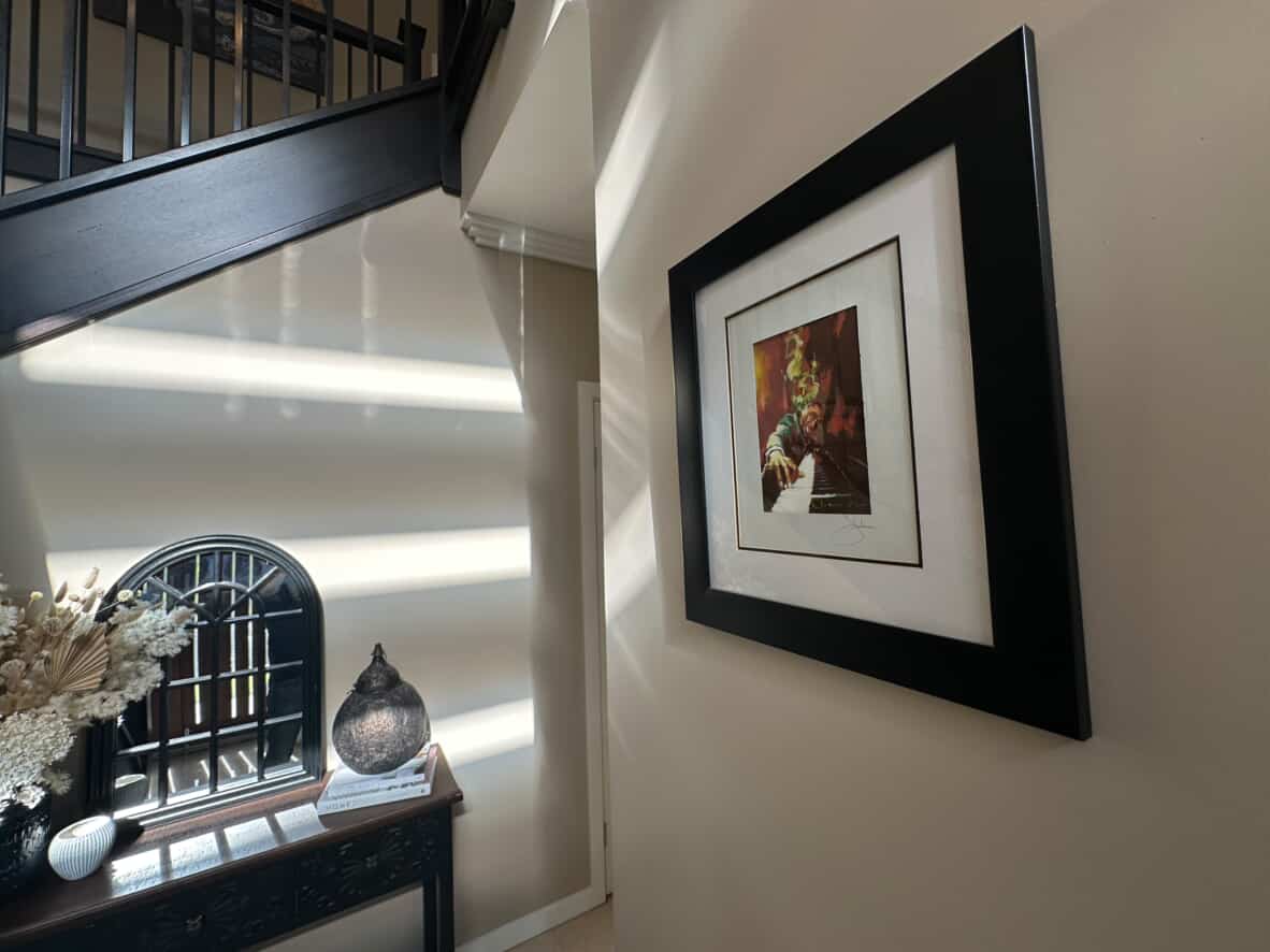 Igor Shulman’s “Piano” print from the Musician Series in Darren’s Australian home, hallway view
