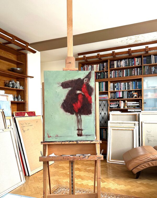 Positive by Igor Shulman on display in the artist’s studio, surrounded by painting tools and gentle studio light.