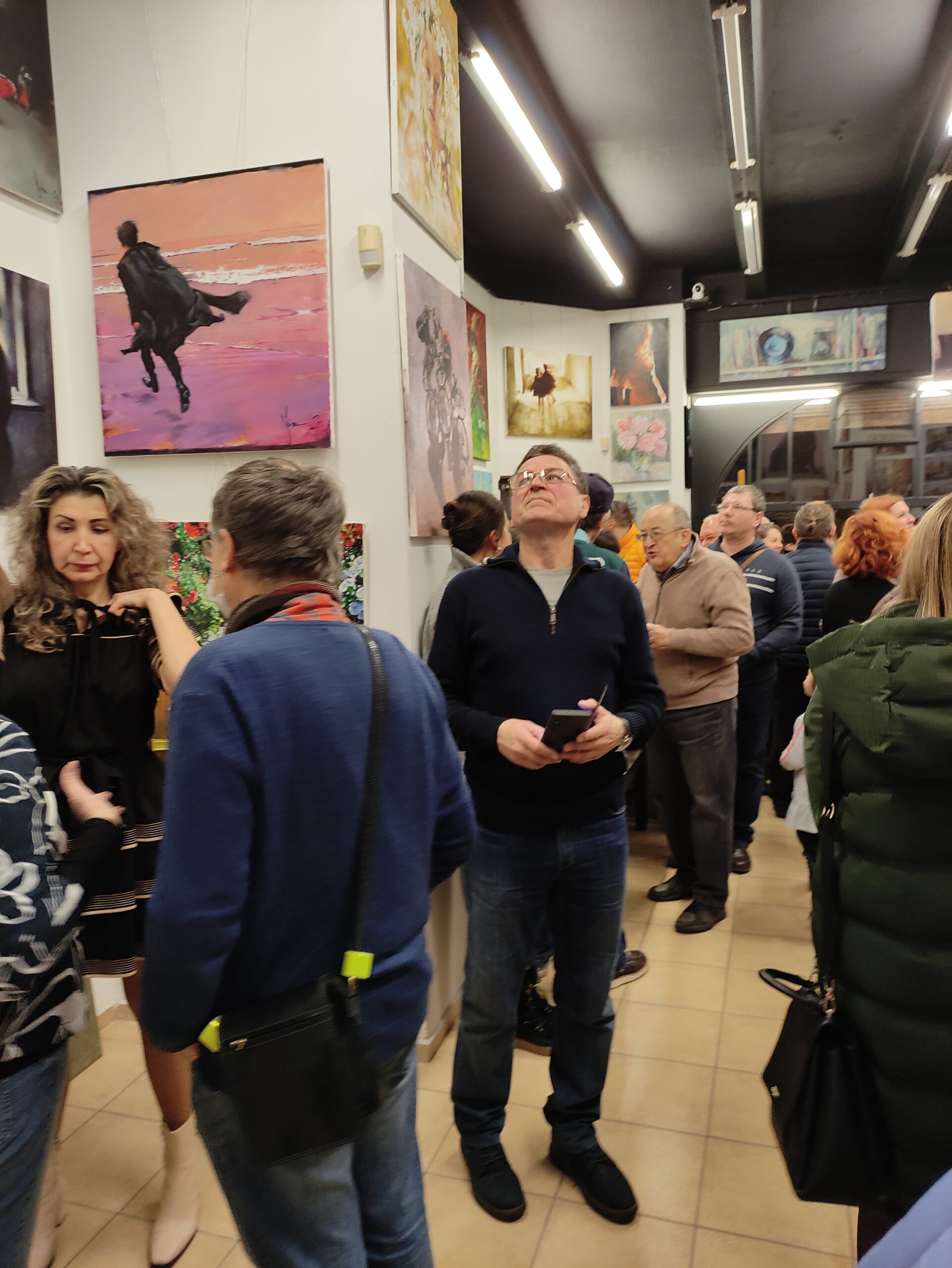 Visitors observing artworks by Igor Shulman during exhibition at ART Gallery 11 Prague