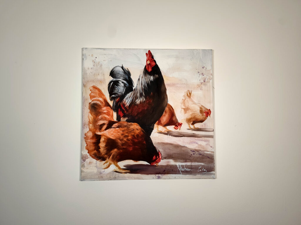 Chicken Yard by Igor Shulman displayed on an interior wall